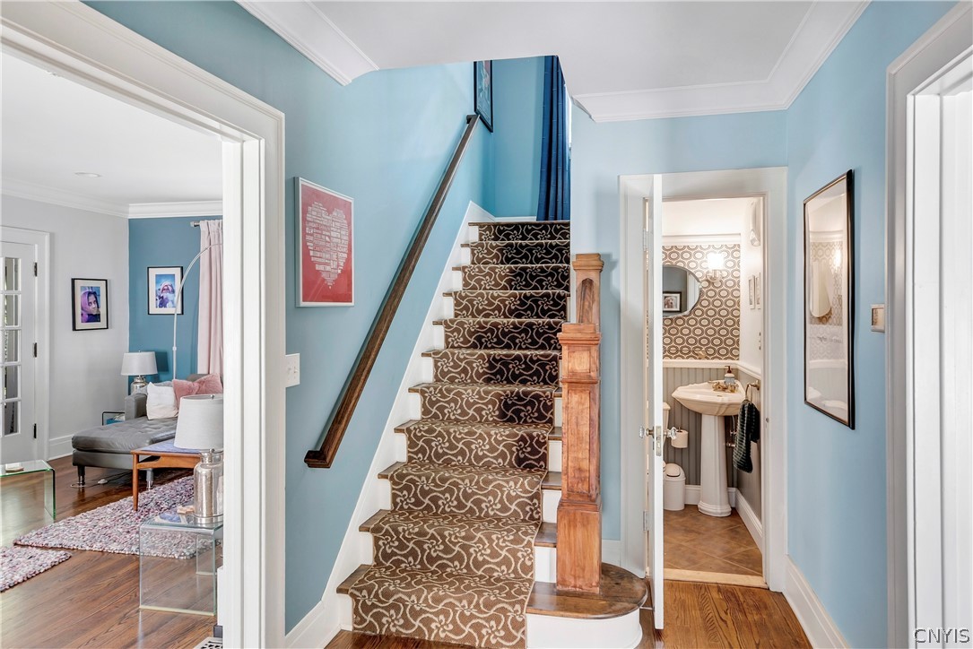 111 Circle Road Syracuse, NY 13210 - Photo 19 of 43 Stairs to second floor with powder room on right