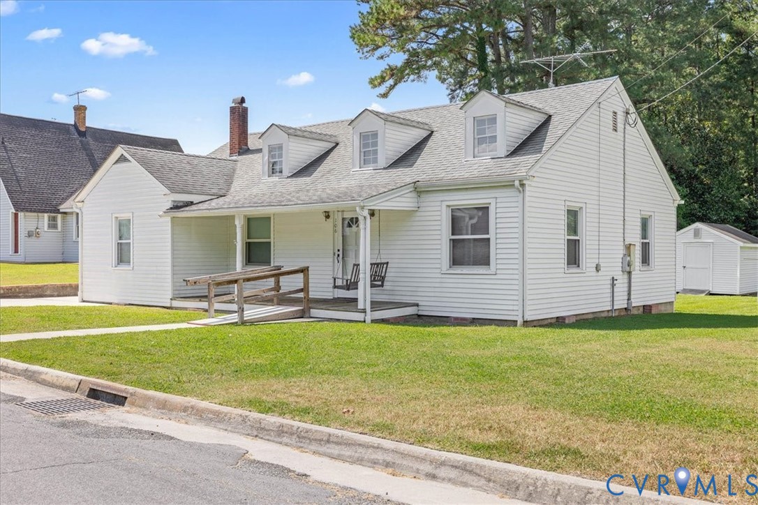 106 Sylvan Road Wakefield, VA 23888 - Photo 3 of 29 Cape cod house featuring covered porch, a front la