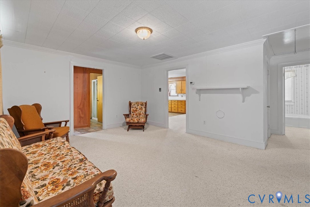 106 Sylvan Road Wakefield, VA 23888 - Photo 5 of 29 Sitting room featuring attic access, light colored