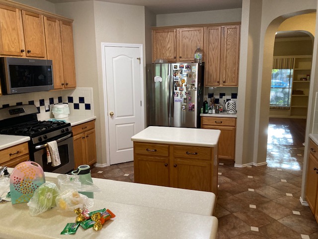 4816 Norman Trail Austin, TX 78749 - Photo 11 of 19 a kitchen with a refrigerator sink and stove