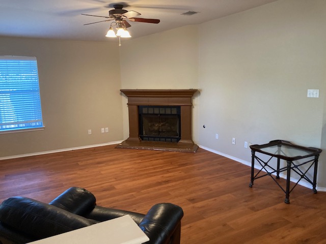 4816 Norman Trail Austin, TX 78749 - Photo 12 of 19 a living room with furniture and a fireplace