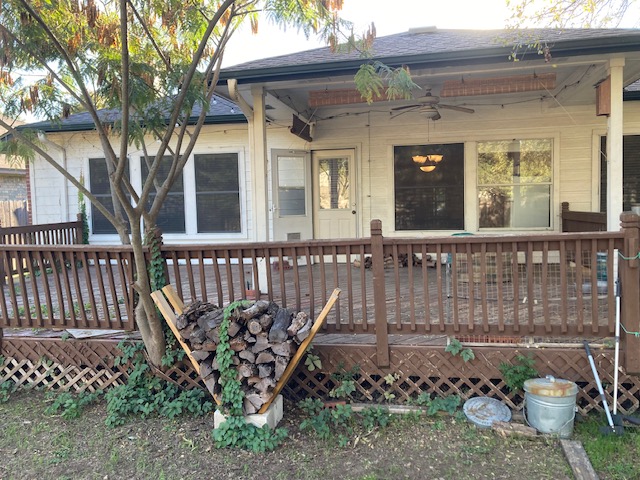 4816 Norman Trail Austin, TX 78749 - Photo 15 of 19 front view of a house with a bench