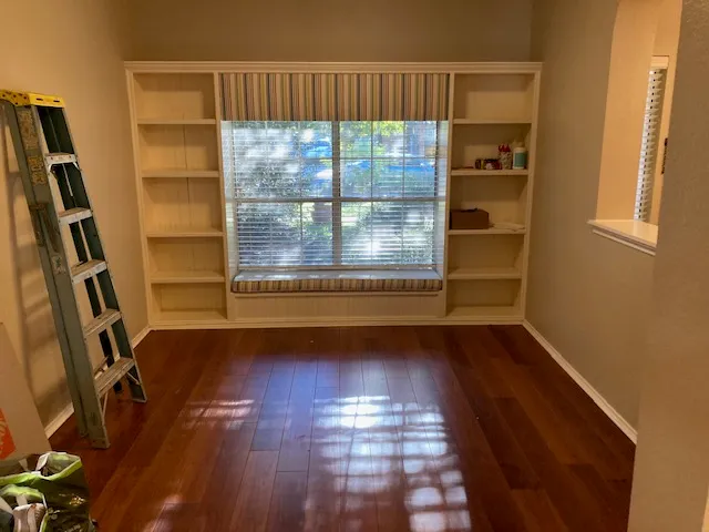 a room with gym equipment and a window