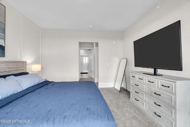 a view of living room with furniture and flat screen tv