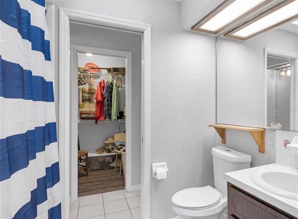 4308 Allen Road Fruitland Park, FL 34731 - Photo 22 of 33 a bathroom with a toilet and a shower curtain