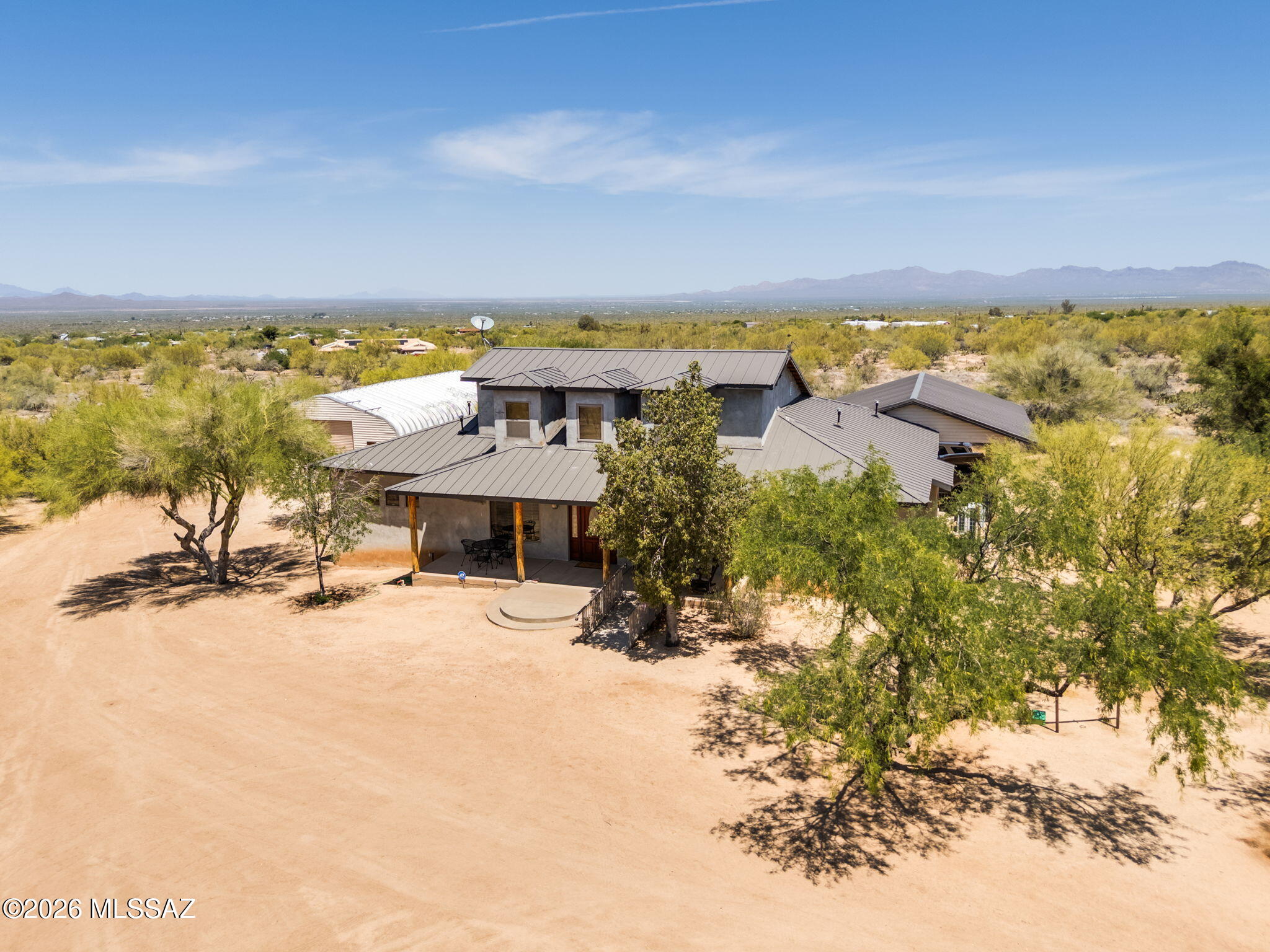 12810 West Gunsmoke Road Tucson, AZ 85736 - Photo 2 of 51 an ocean beach with seating space