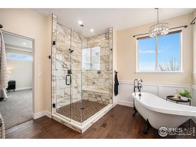 a bathroom with a bathtub shower sink and toilet