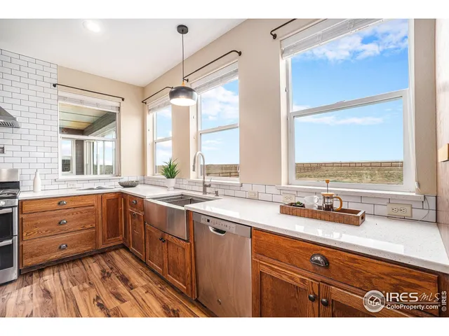 a kitchen with sink cabinets and window