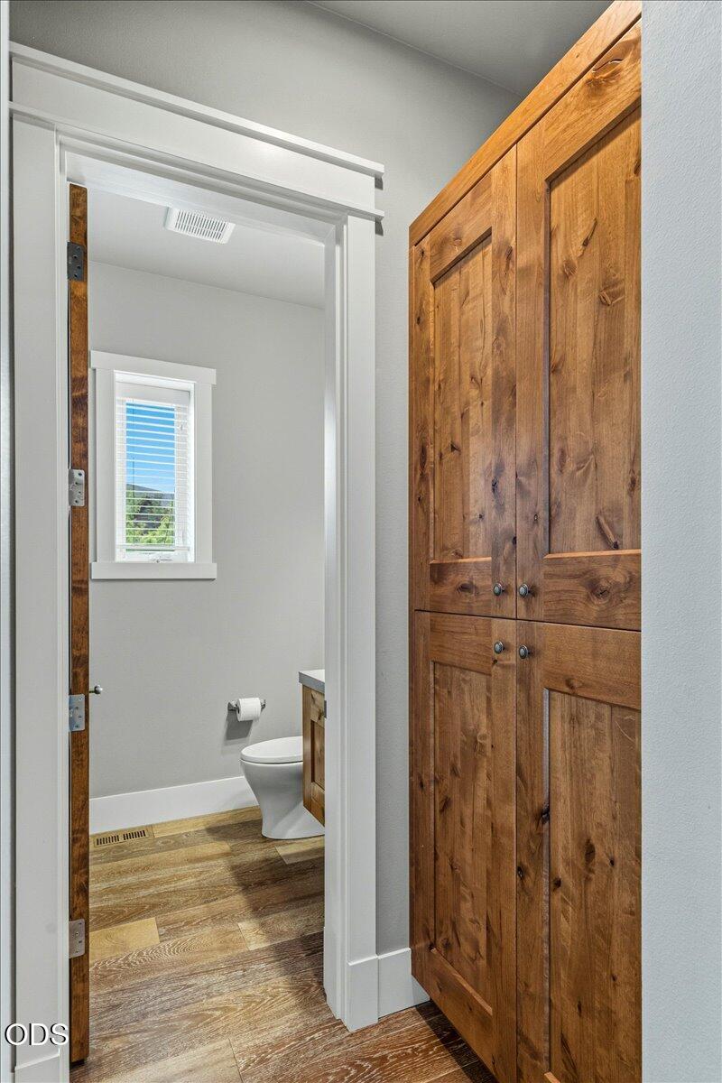61333 Kindle Rock Loop Bend, OR 97702 - Photo 15 of 53 a view of a bathroom with wooden floor and a window