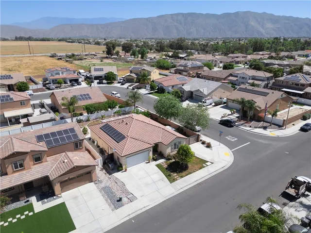an aerial view of residential houses and outdoor space