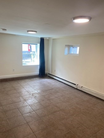 80 Orleans Street, Unit B Boston, MA 02128 - Photo 5 of 9 an empty room with a empty space and window