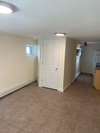 80 Orleans Street, Unit B Boston, MA 02128 - Photo 6 of 9 an empty room with windows