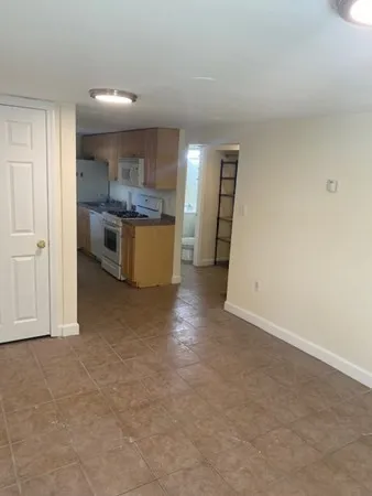 a view of a kitchen with a sink and cabinets