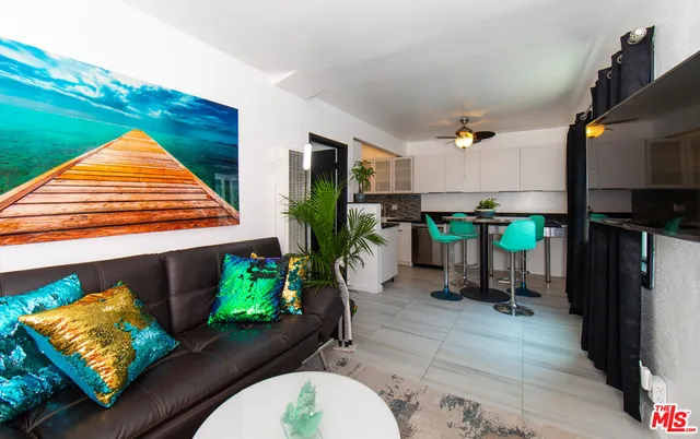 a view of a living room and dining room