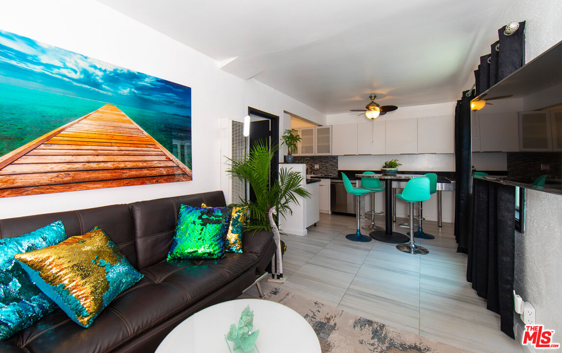 a view of a living room and dining room