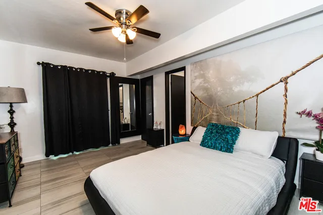 a bedroom with a bed and a closet