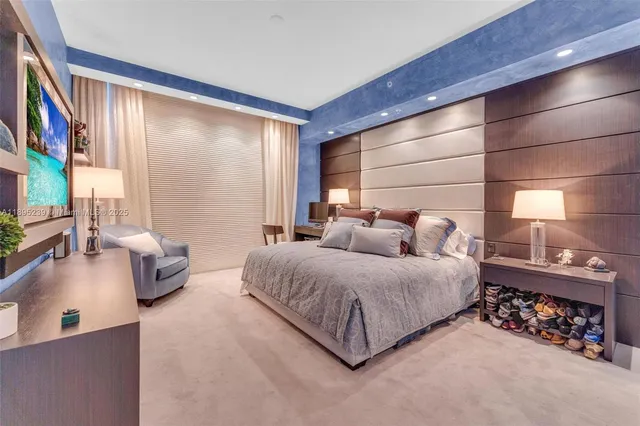 a spacious bedroom with a bed and large windows