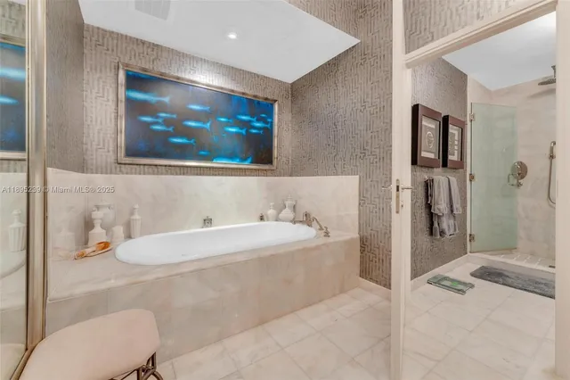 a bathroom with a bathtub and a sink