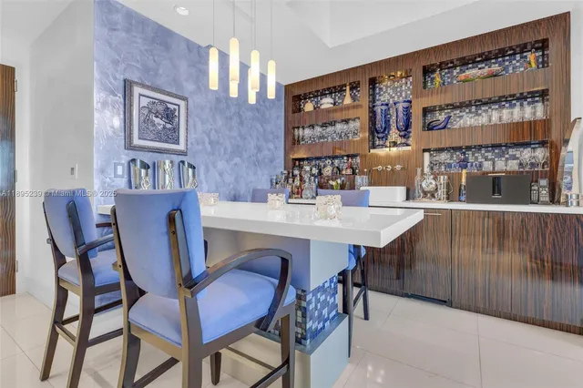 a dining room with a table and chairs