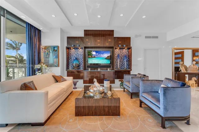 a living room with fireplace furniture and a flat screen tv