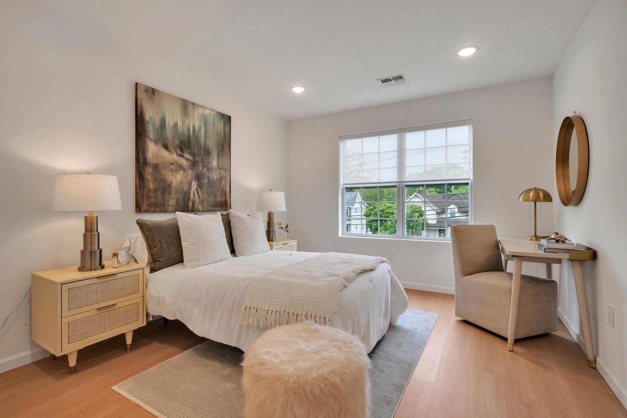 70 Ridgedale Avenue, Unit 103 Morristown, NJ 07960 - Photo 20 of 50 a bedroom with a bed a couch and a window