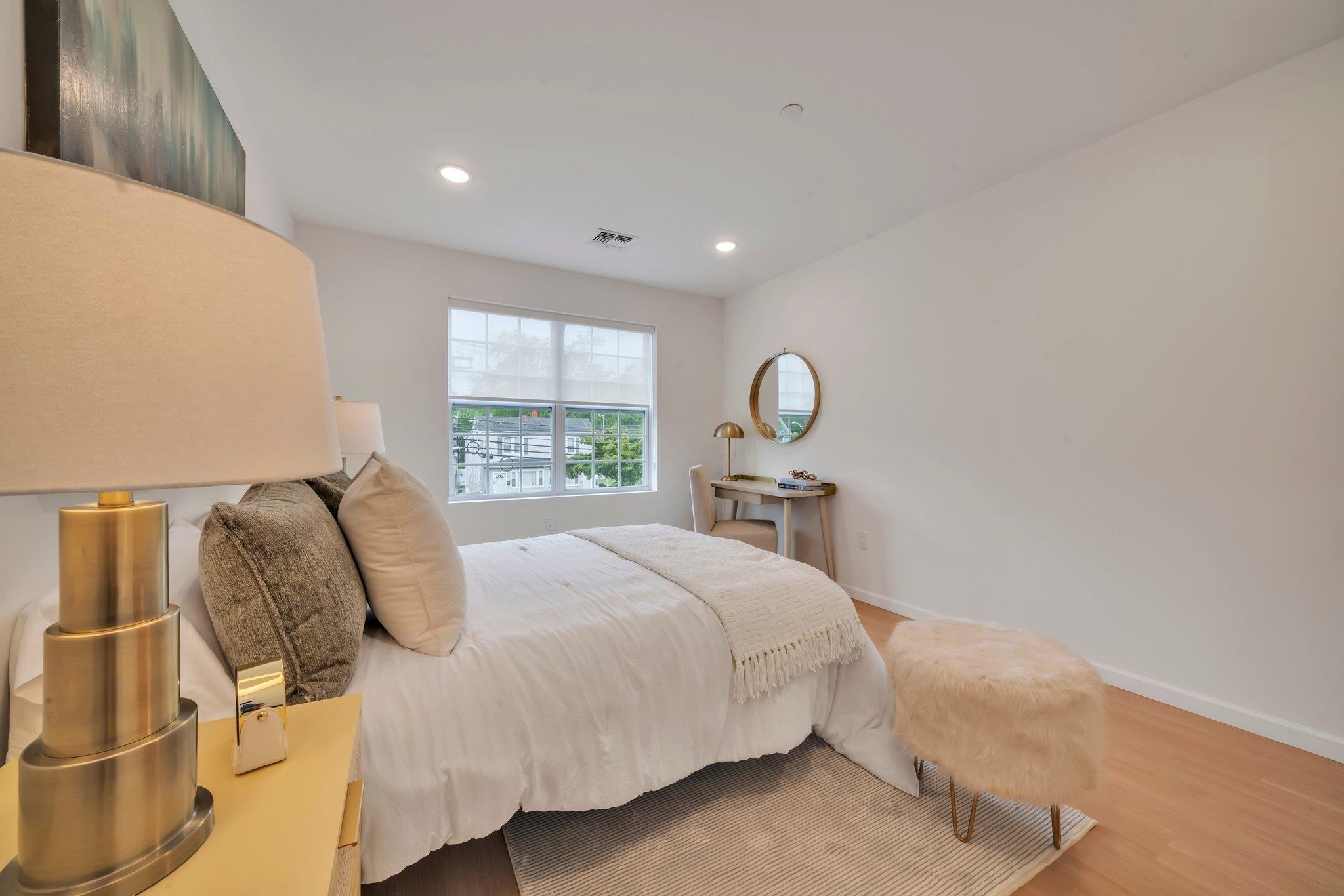 70 Ridgedale Avenue, Unit 103 Morristown, NJ 07960 - Photo 25 of 50 a bedroom with a bed and window