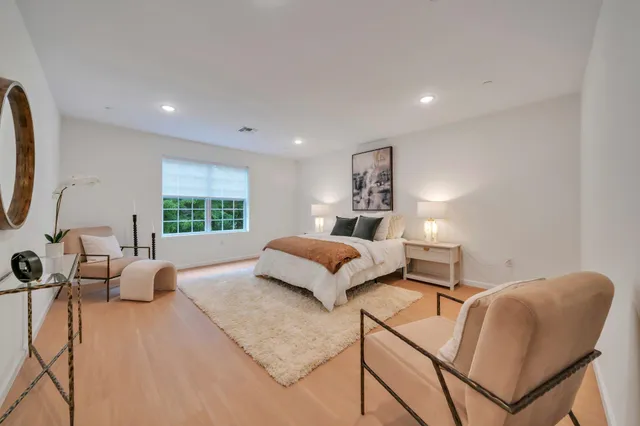 a bedroom with a bed and a table