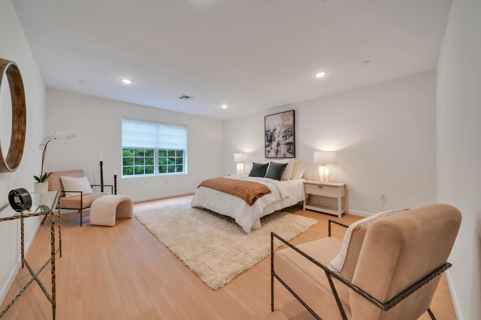70 Ridgedale Avenue, Unit 103 Morristown, NJ 07960 - Photo 33 of 50 a bedroom with a bed and glass window