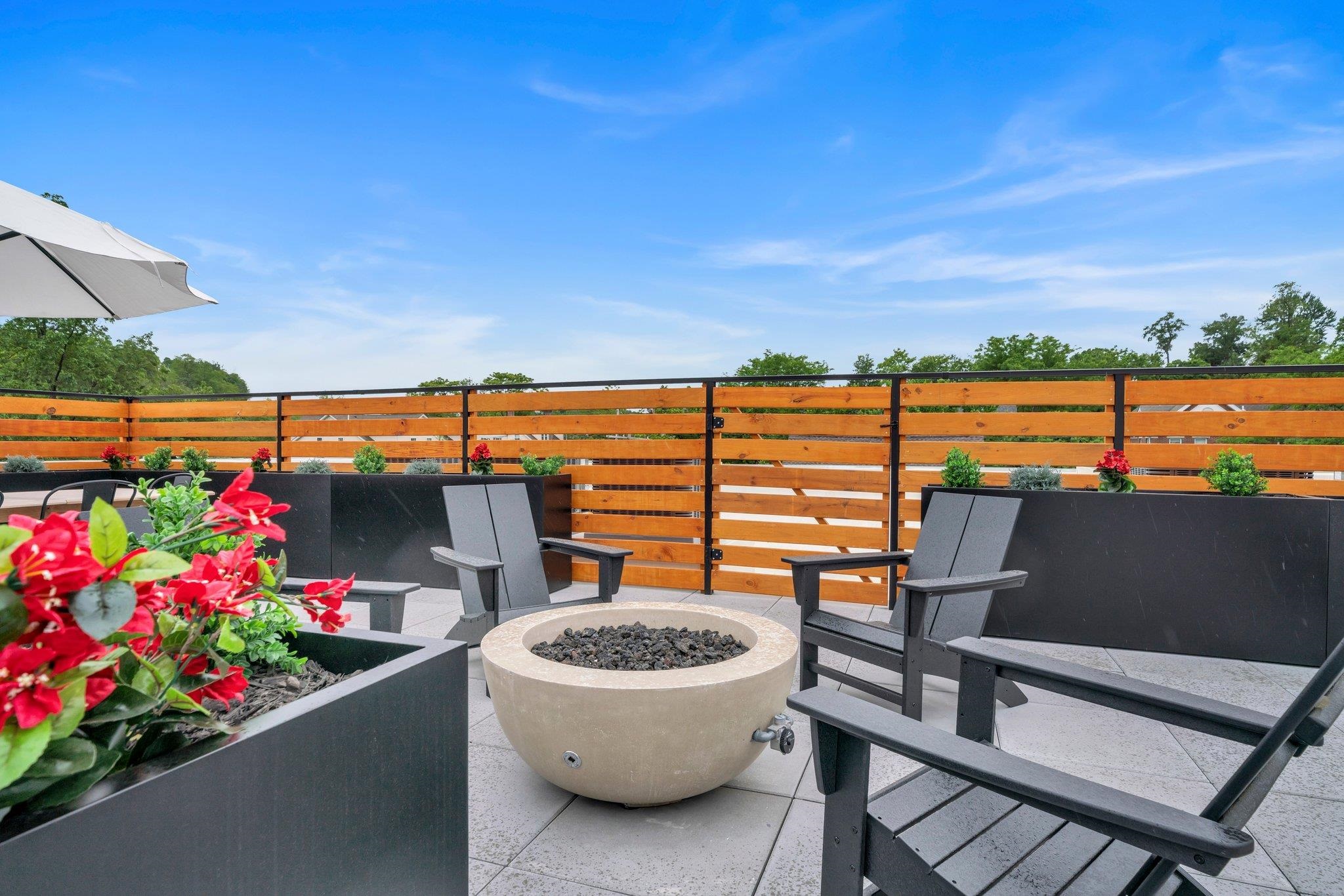 70 Ridgedale Avenue, Unit 103 Morristown, NJ 07960 - Photo 43 of 50 a view of a terrace with furniture and stove