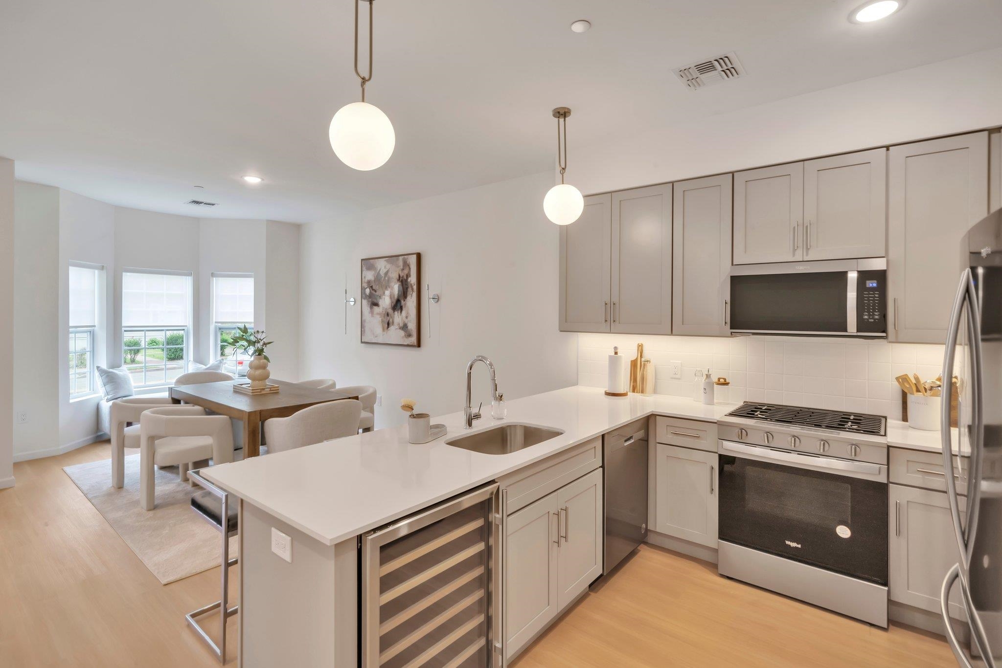 70 Ridgedale Avenue, Unit 103 Morristown, NJ 07960 - Photo 5 of 50 a kitchen that has a sink and a stove in it
