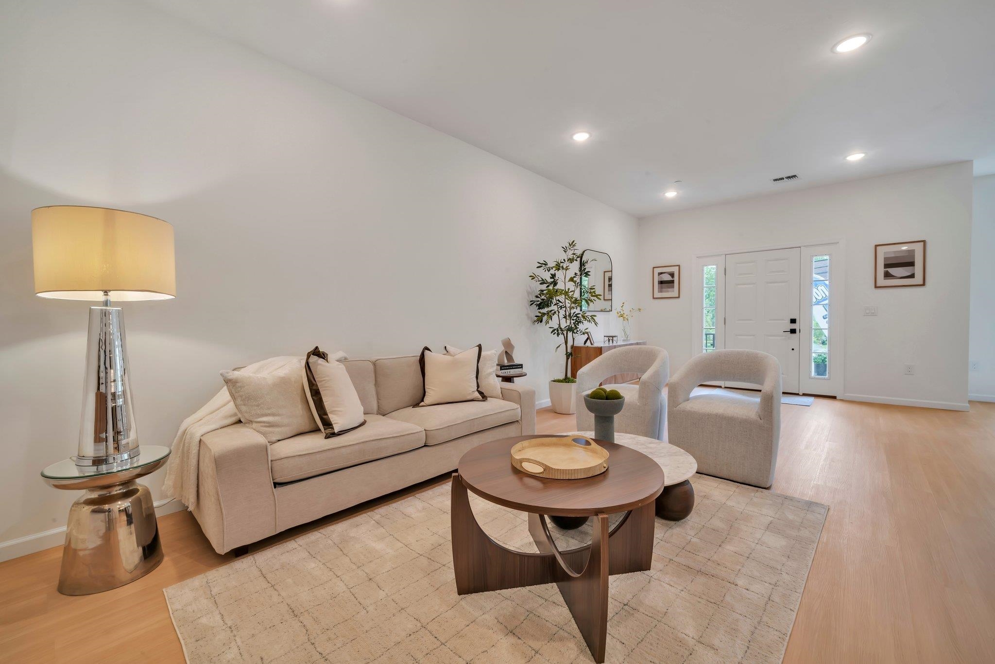 70 Ridgedale Avenue, Unit 103 Morristown, NJ 07960 - Photo 8 of 50 a living room with furniture a lamp and a rug