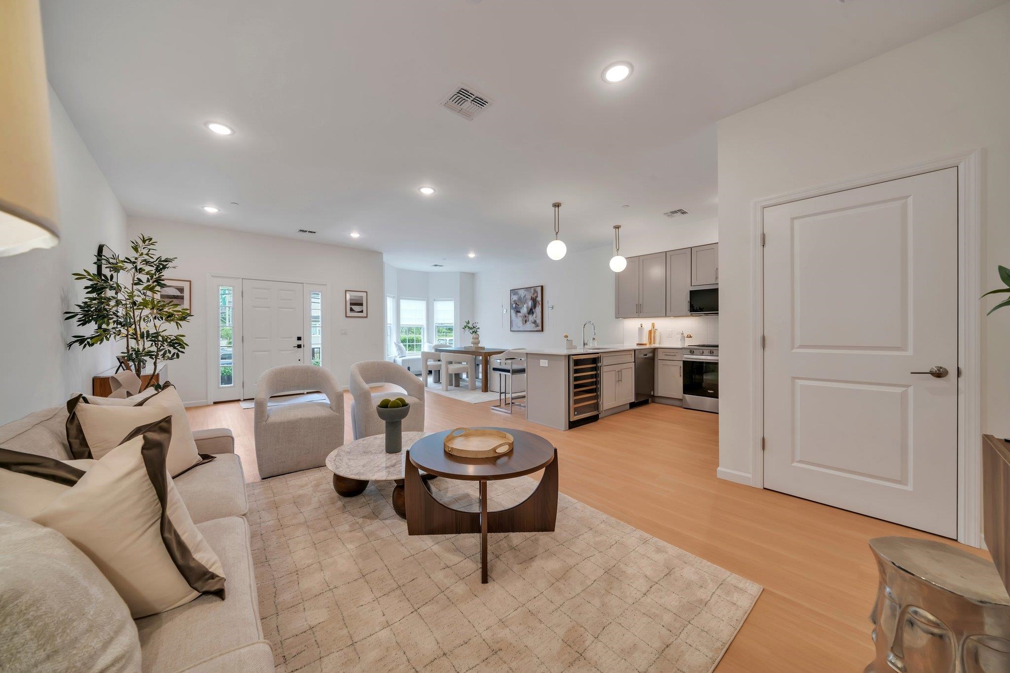 70 Ridgedale Avenue, Unit 103 Morristown, NJ 07960 - Photo 9 of 50 a living room with furniture a clock and kitchen view