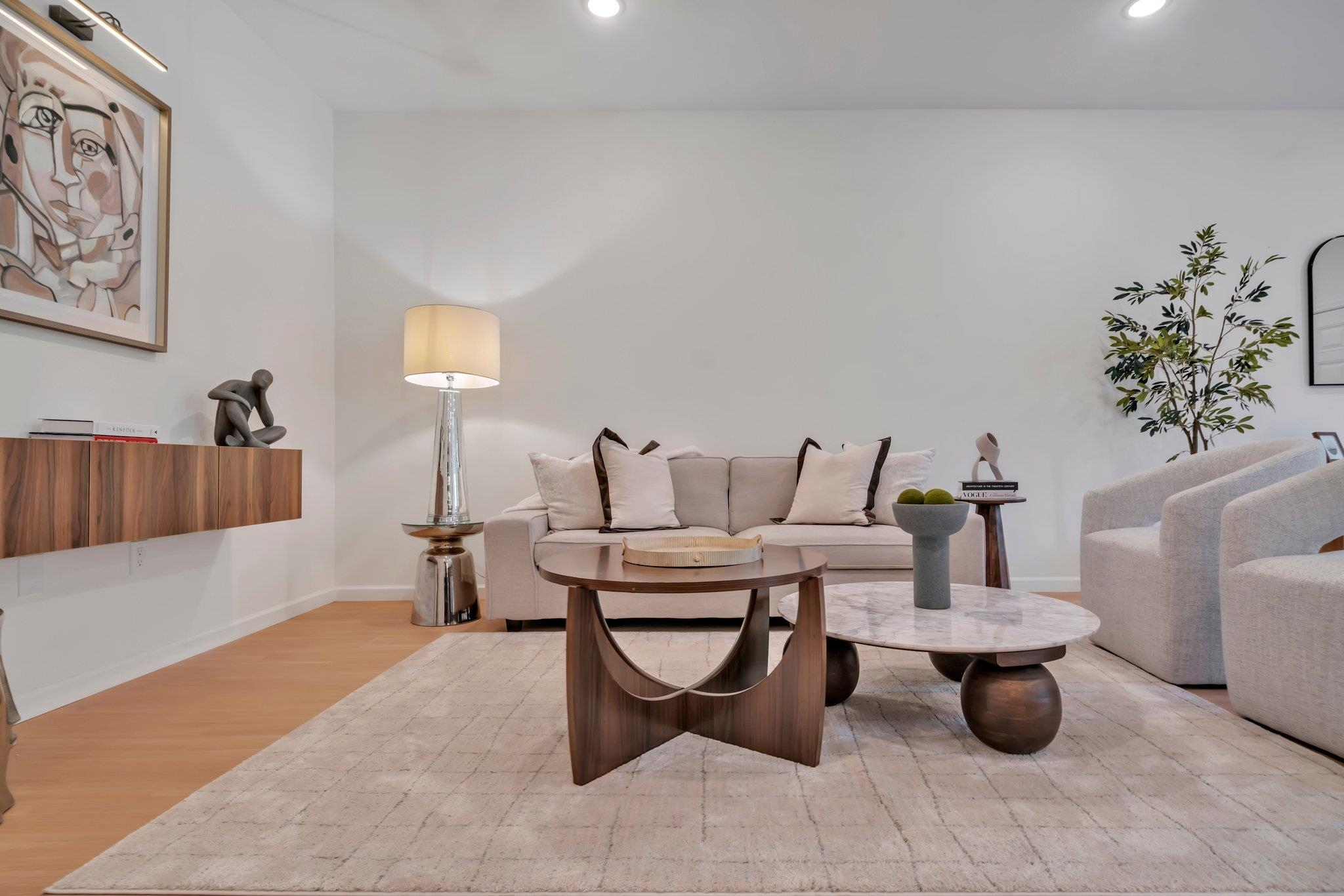 70 Ridgedale Avenue, Unit 103 Morristown, NJ 07960 - Photo 10 of 50 a living room with furniture and a potted plant
