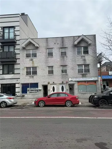 a cars parked in front of a building