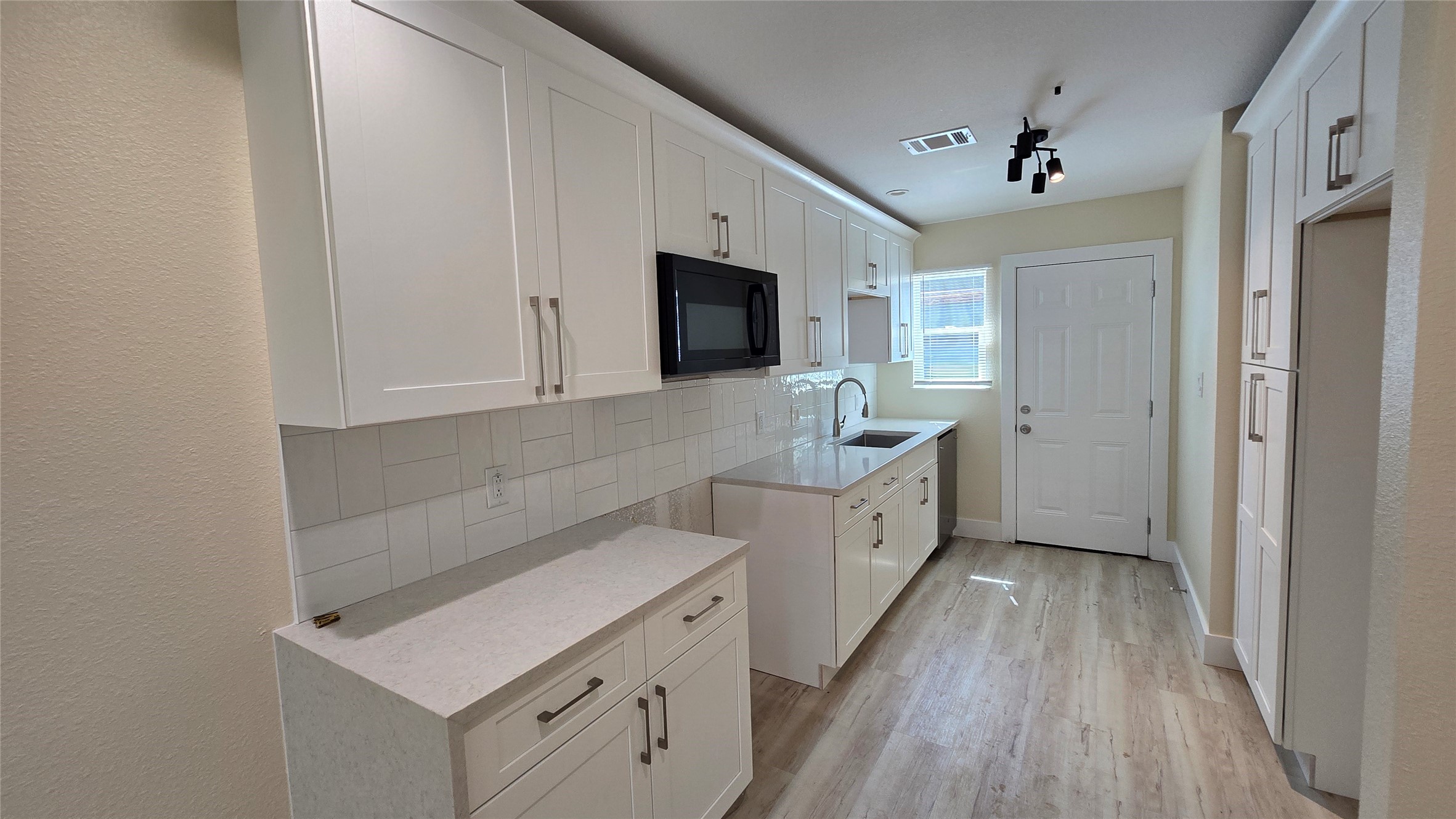 3741 Seabrook Street Houston, TX 77021 - Photo 34 of 50 a kitchen with a sink cabinets and wooden floor