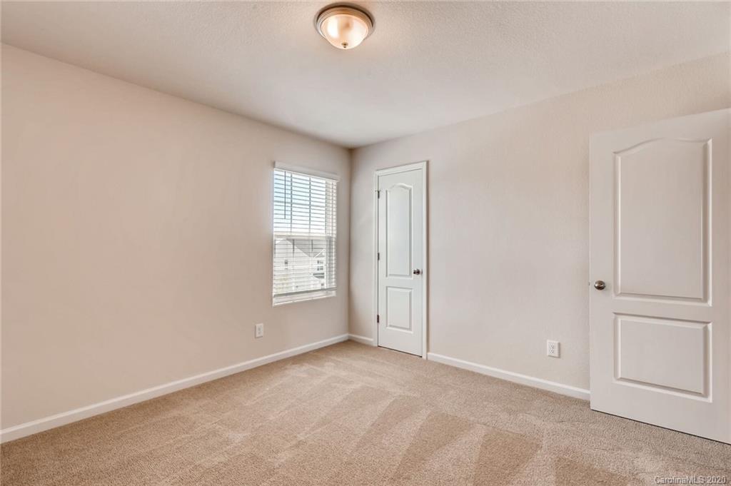 3421 Ellingford Road Charlotte, NC 28214 - Photo 13 of 16 a view of an empty room and window