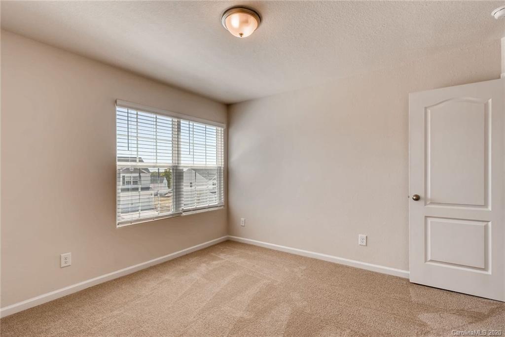 3421 Ellingford Road Charlotte, NC 28214 - Photo 14 of 16 an empty room with windows
