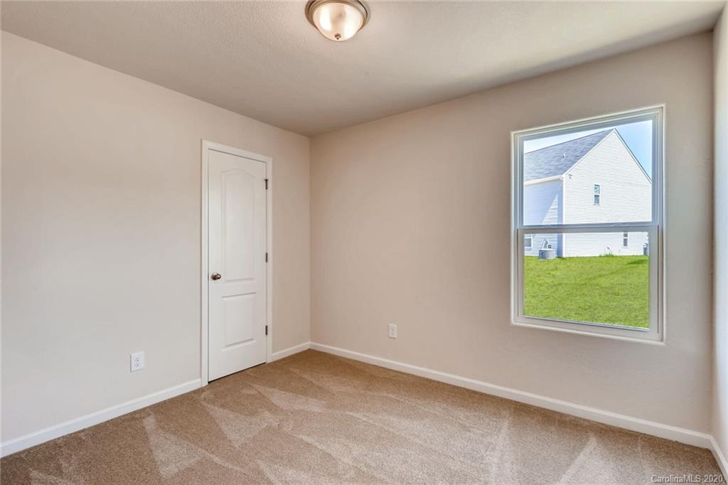 3421 Ellingford Road Charlotte, NC 28214 - Photo 15 of 16 an empty room with windows and closet