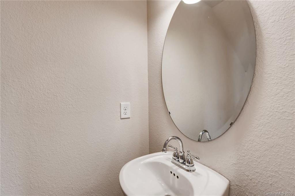 3421 Ellingford Road Charlotte, NC 28214 - Photo 9 of 16 a bathroom with a sink and a mirror