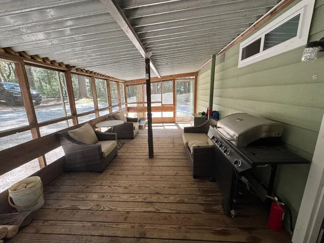 a kitchen with refrigerator and cabinets