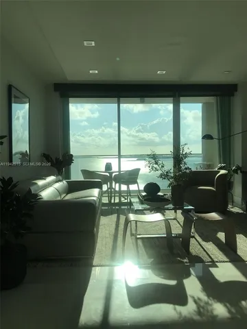 a living room with furniture and a rug