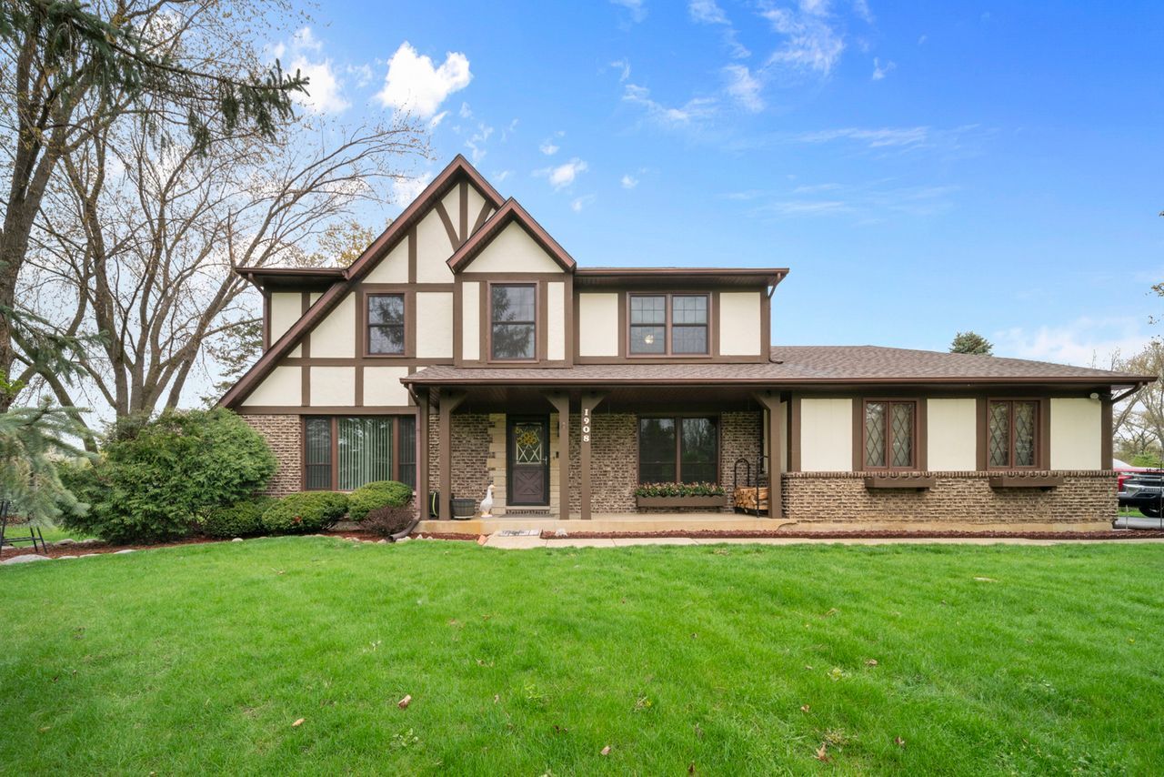 1908 Spring Dale Drive Spring Grove, IL 60081 - Photo 2 of 17 a front view of a house with a yard