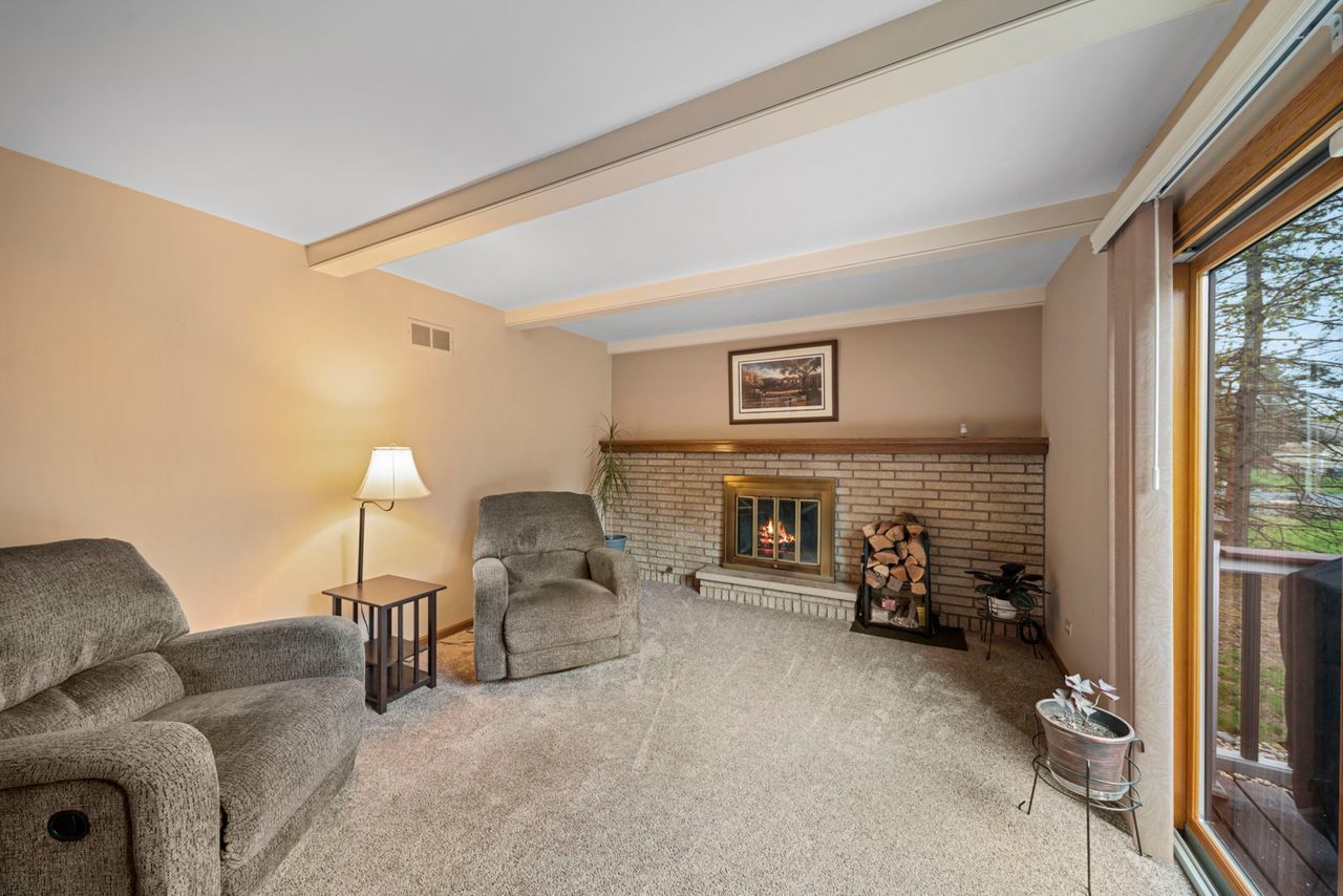 1908 Spring Dale Drive Spring Grove, IL 60081 - Photo 7 of 17 a living room with furniture and a fireplace