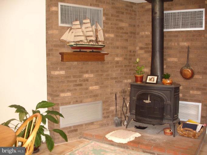 10 Ridge Road Severna Park, MD 21146 - Photo 11 of 23 Woodstove by breakfast nook