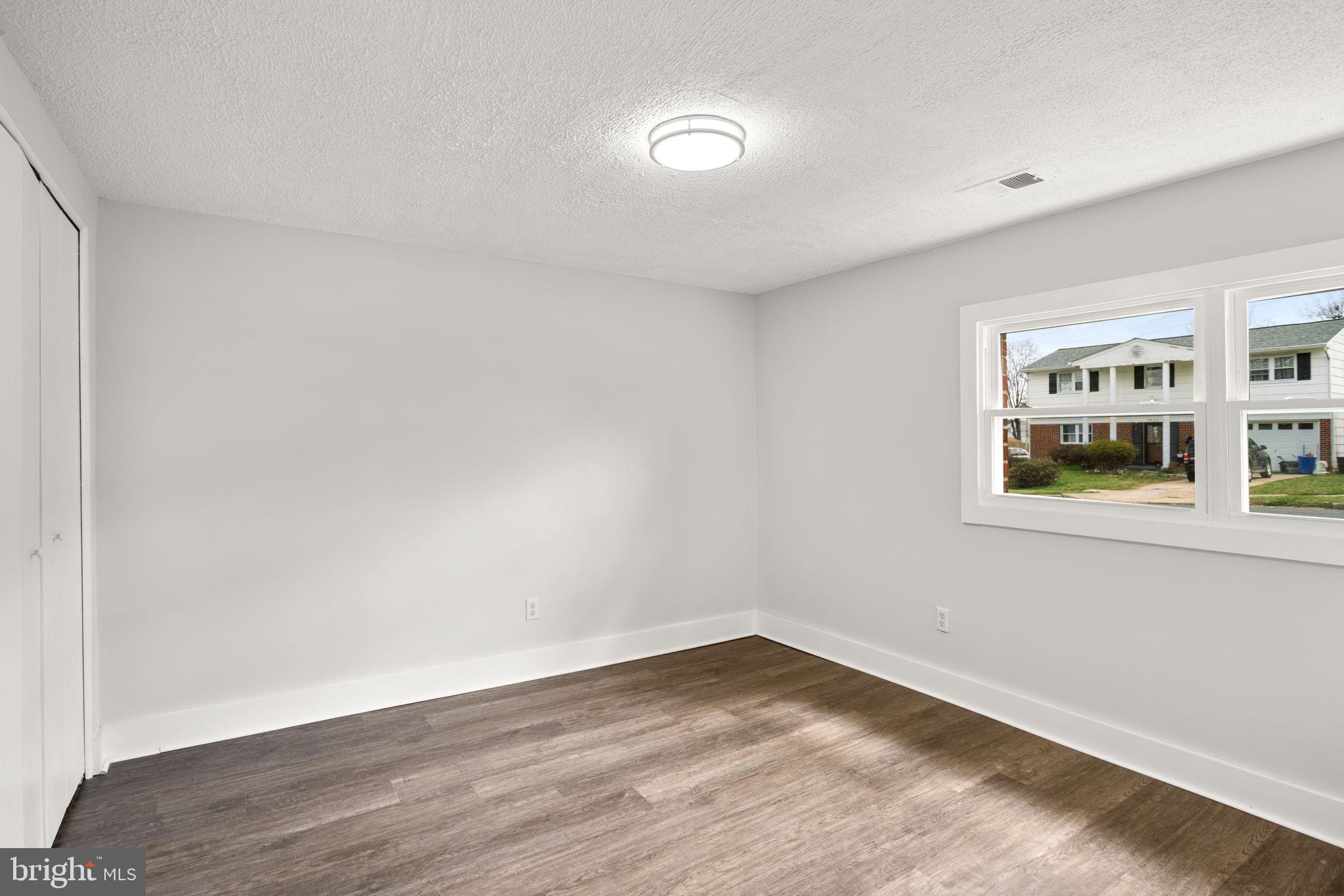 3908 Rayton Road Randallstown, MD 21133 - Photo 15 of 42 a view of empty room with wooden floor and fan