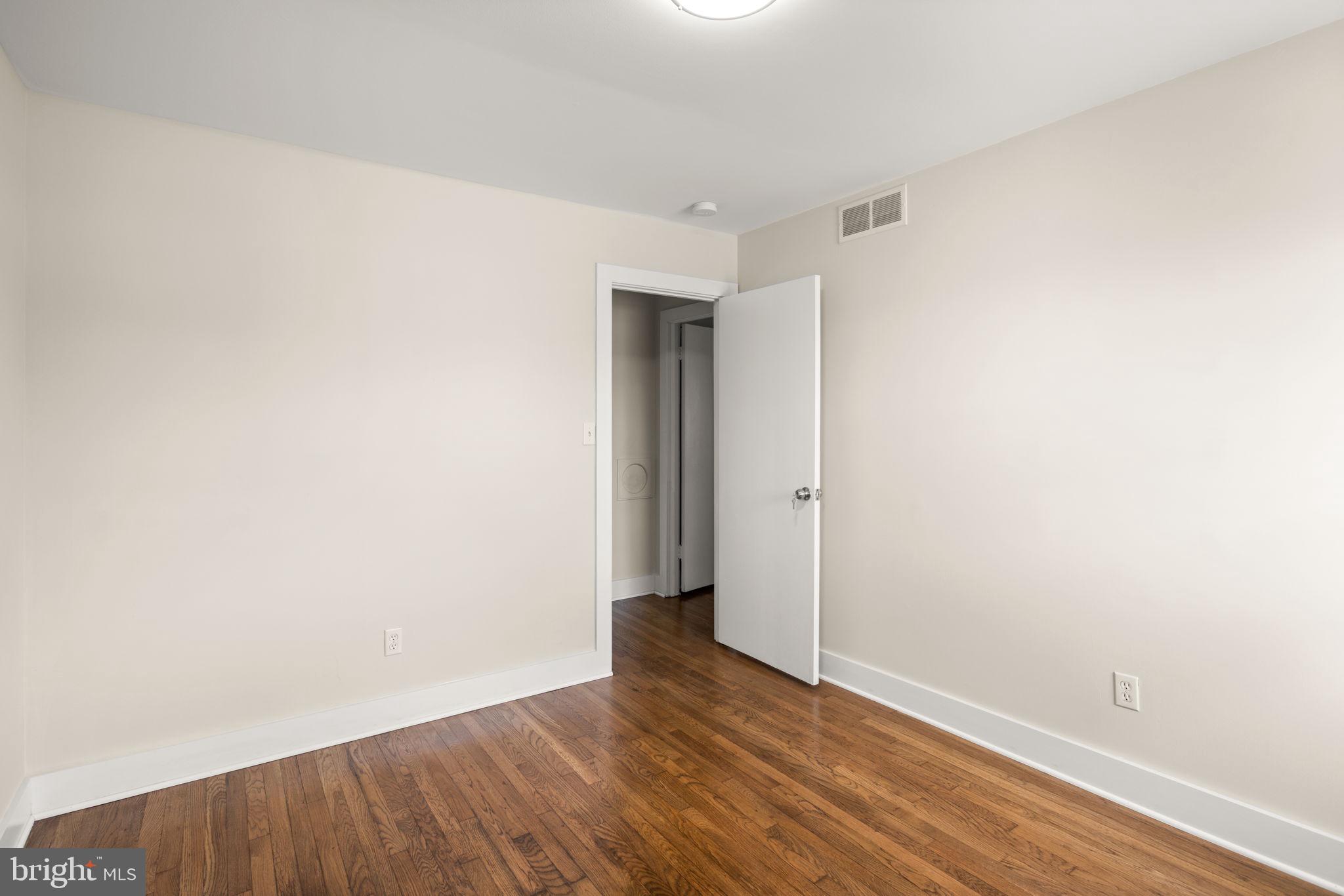 3908 Rayton Road Randallstown, MD 21133 - Photo 17 of 42 a view of an empty room with wooden floor