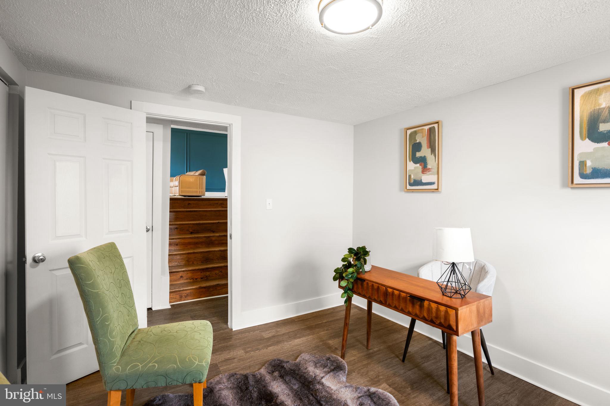3908 Rayton Road Randallstown, MD 21133 - Photo 25 of 42 a view of a workspace with furniture and wooden floor