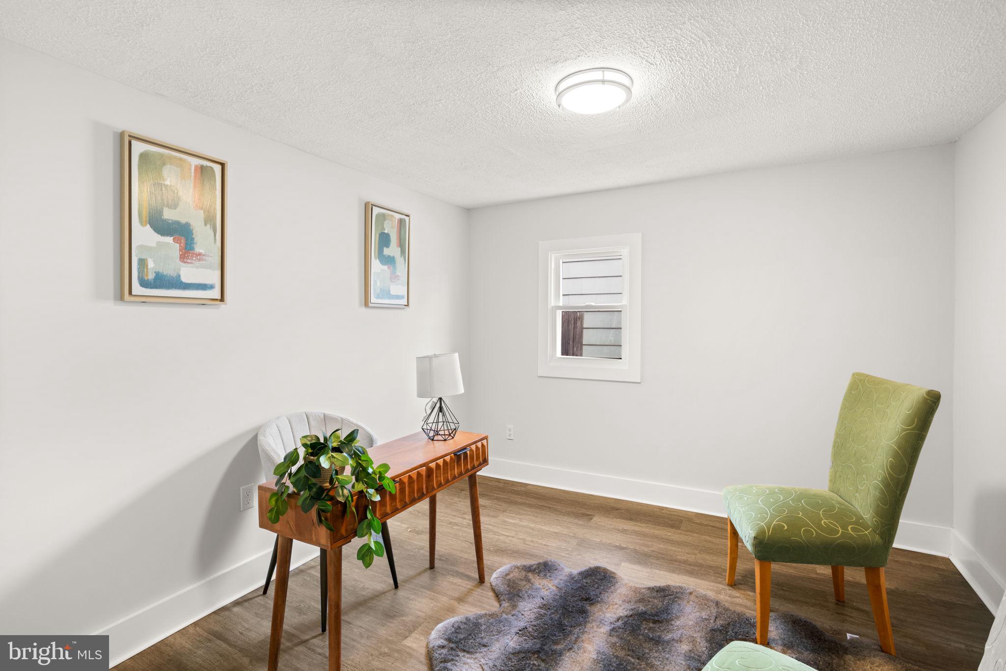 3908 Rayton Road Randallstown, MD 21133 - Photo 26 of 42 a living room with furniture and a potted plant
