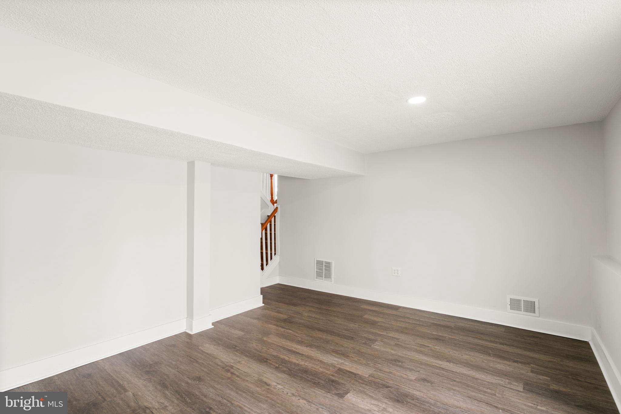 3908 Rayton Road Randallstown, MD 21133 - Photo 30 of 42 a view of empty room with wooden floor