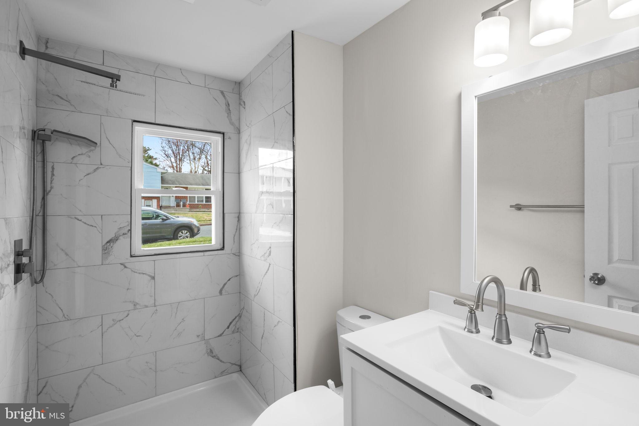 3908 Rayton Road Randallstown, MD 21133 - Photo 32 of 42 a bathroom with a sink toilet and shower